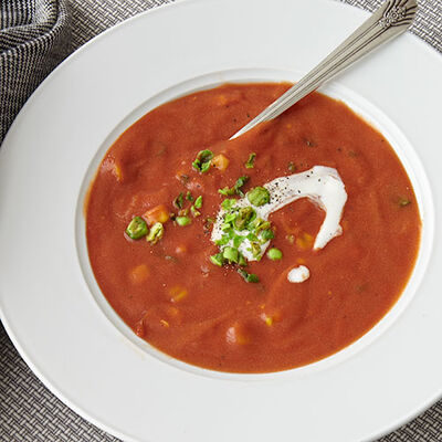 Creamy Tomato Soup Garnished with Wasabi Peas