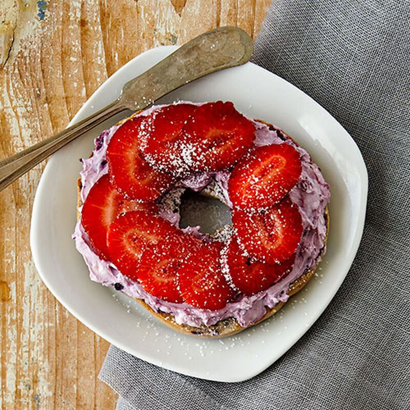 Blueberry Cream Cheese topped with Strawberries Bagel