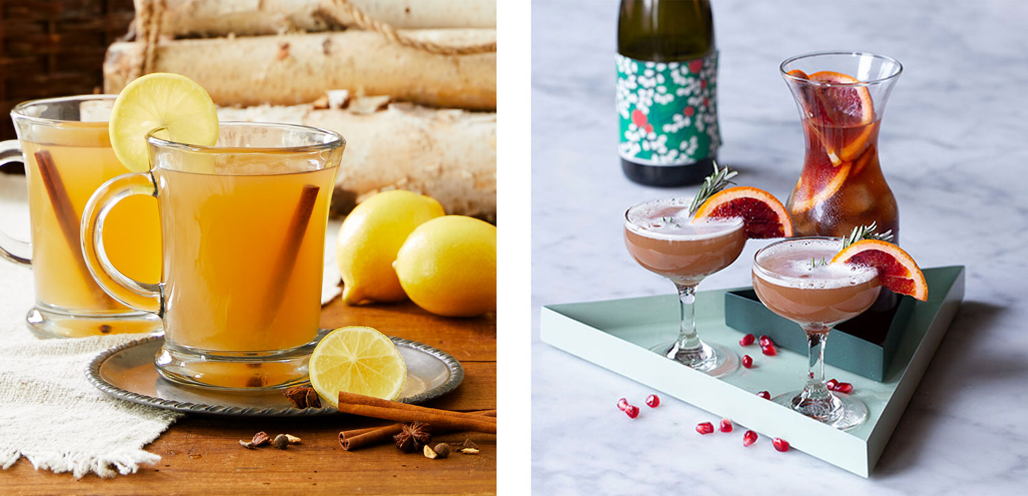 A side-by-side image of two different drinks. The left image is of a lemon hot toddy in a glass mug on a small gray saucer with some whole and sliced lemons and sprigs of cinnamon. The image on the right is of two glasses of Mulled Pomegranate cocktail in a triangle serving tray on a granite counterop.