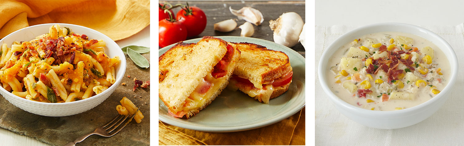 A side-by-side image of three different dishes. The first image is of a bowl of butternut squash pasta, the middle image is of garlicky grilled cheese on a saucer with tomatoes and garlic in the background, and the last image on the right is of a white bowl of corn chowder on a white counter.