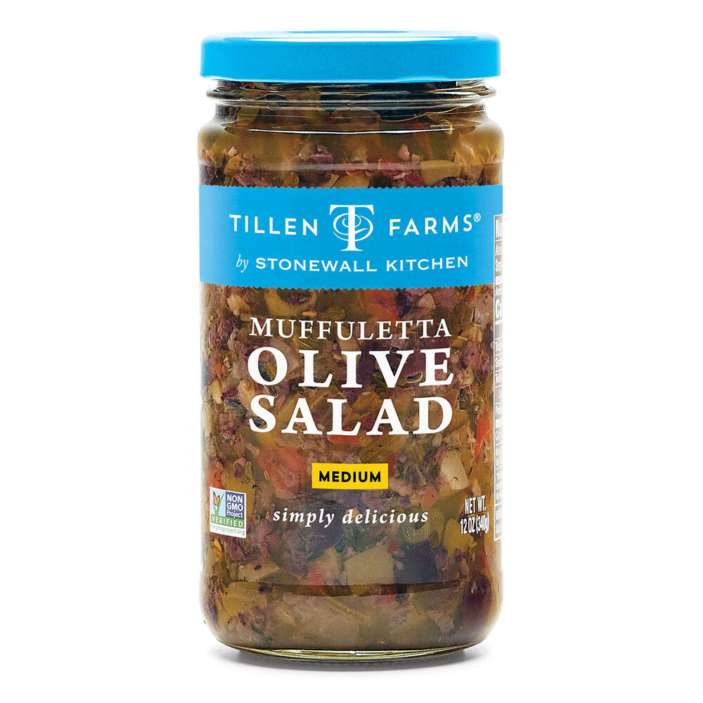 Image of a glass jar of Muffuletta Olive Salad on a white background.