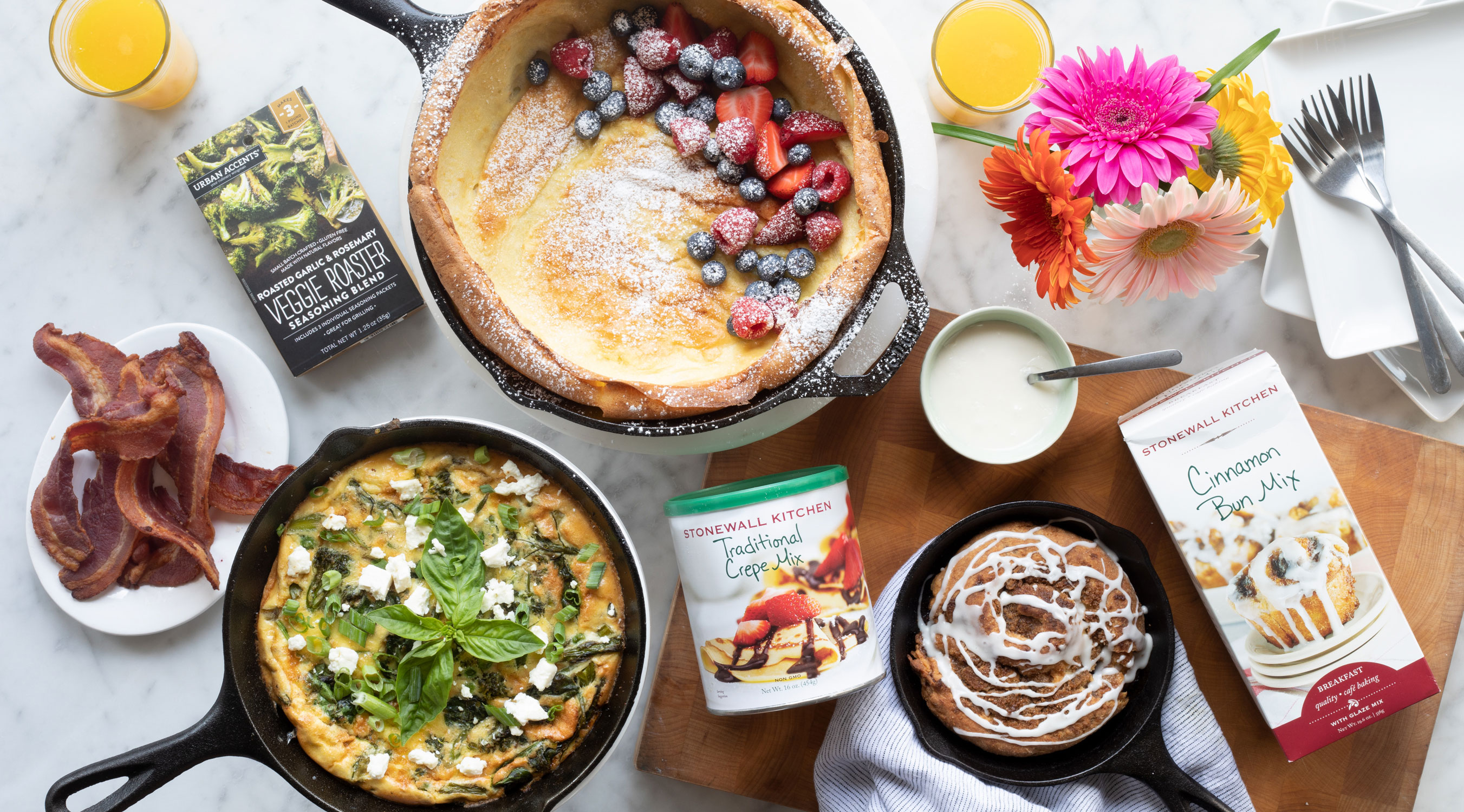 image of an array of various foods cooked in cast iron skillets